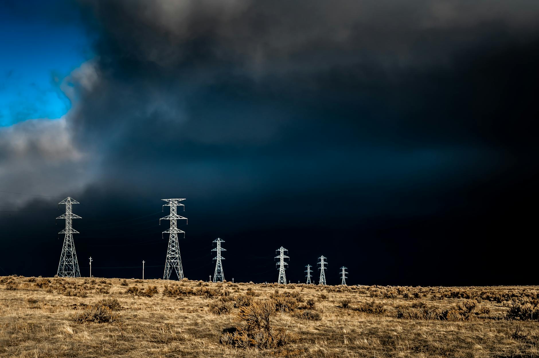 electric lines over cloudy sky
