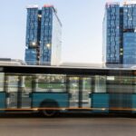 bucharest urban scene with modern buildings and bus