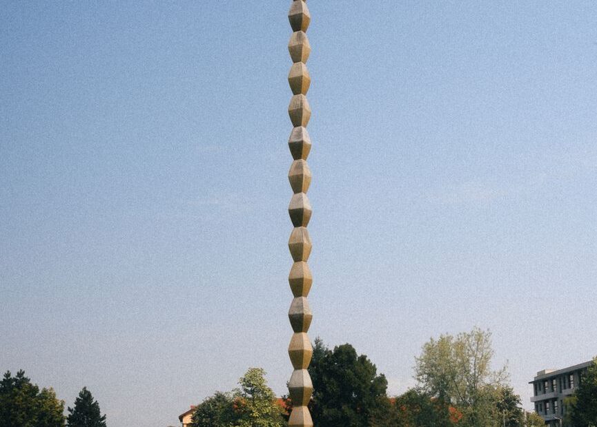 endless column sculpture in autumn park